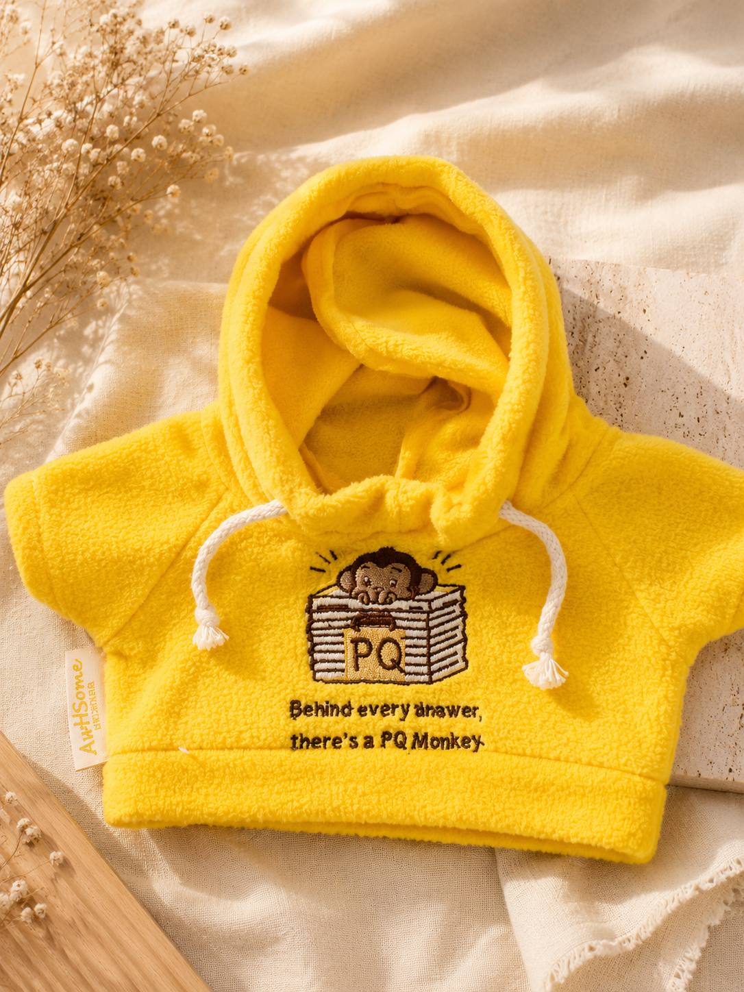 Yellow baby hoodie with character embroidery